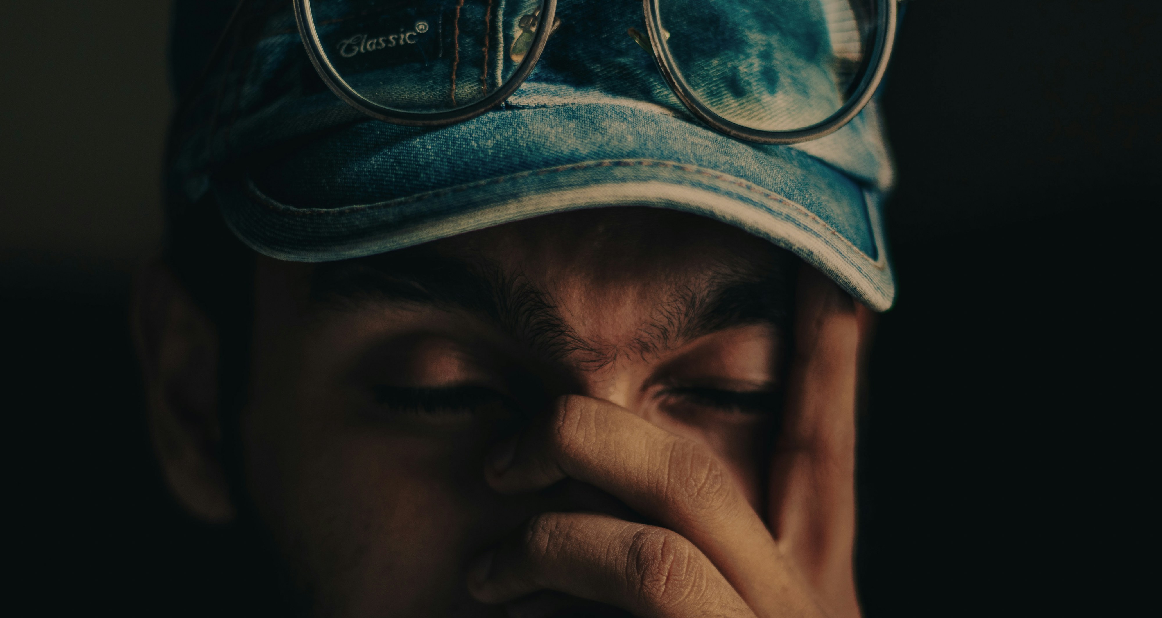 person holding black and white cap