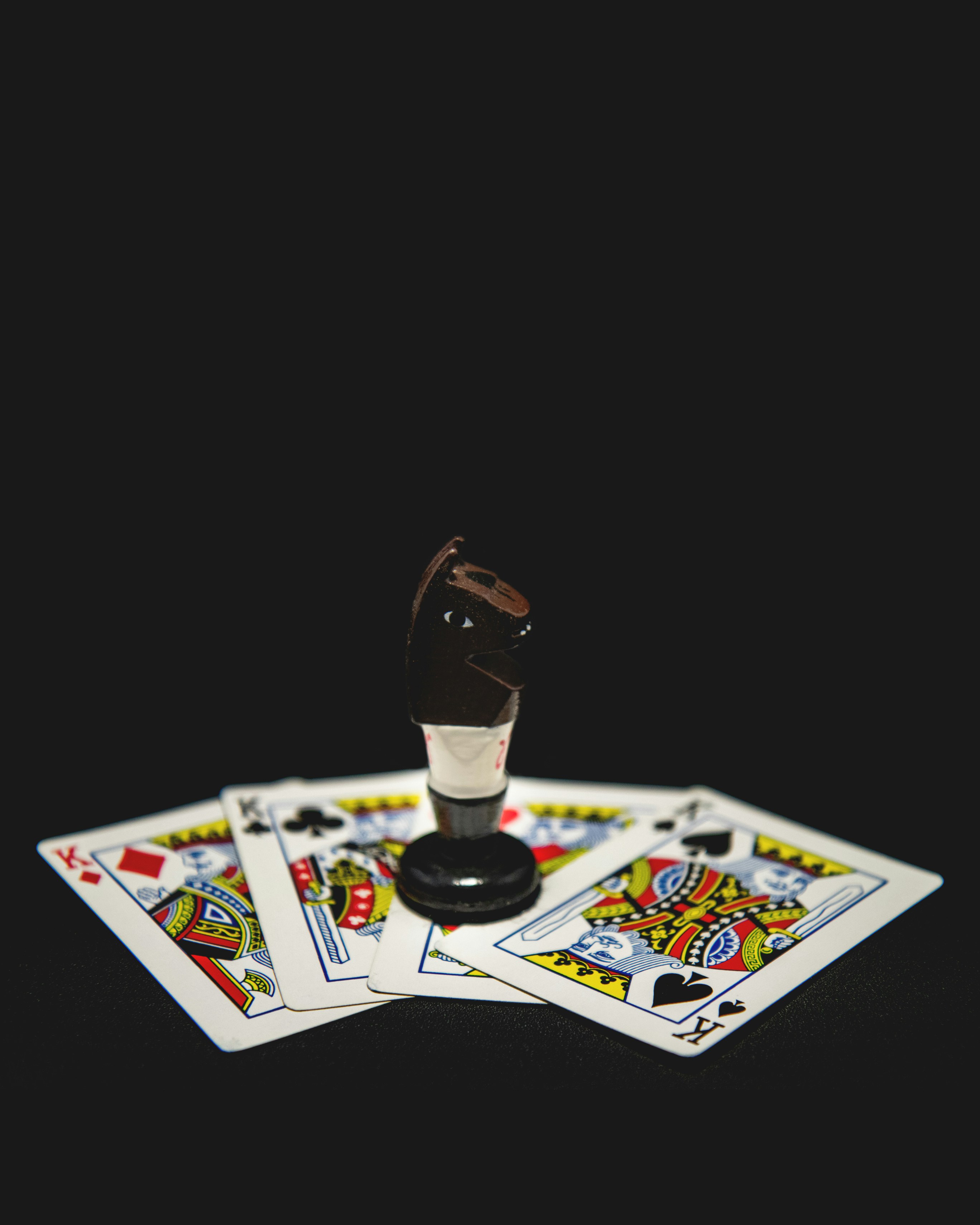 a set of four playing cards and a game of cards