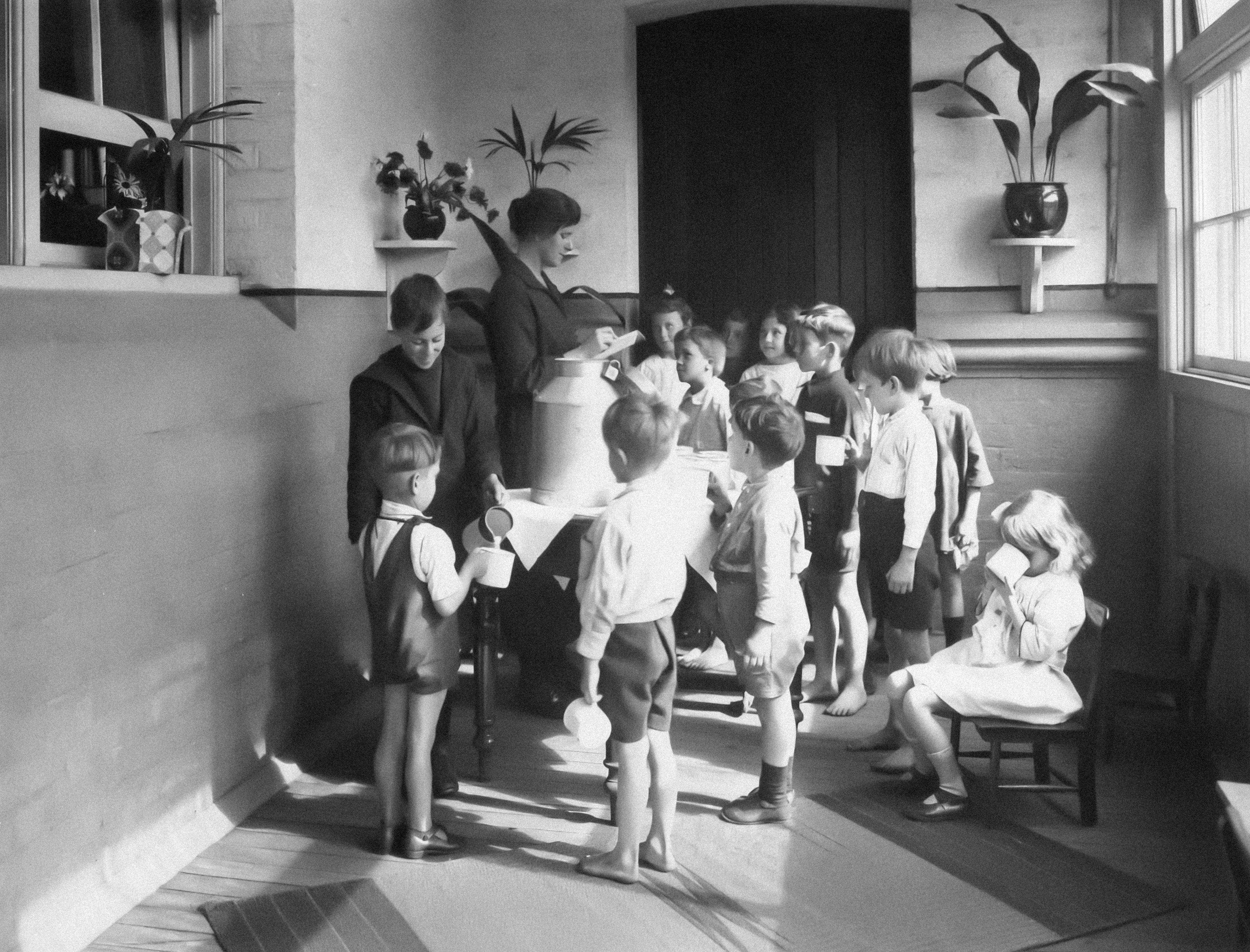 a black and white photo of a group of children