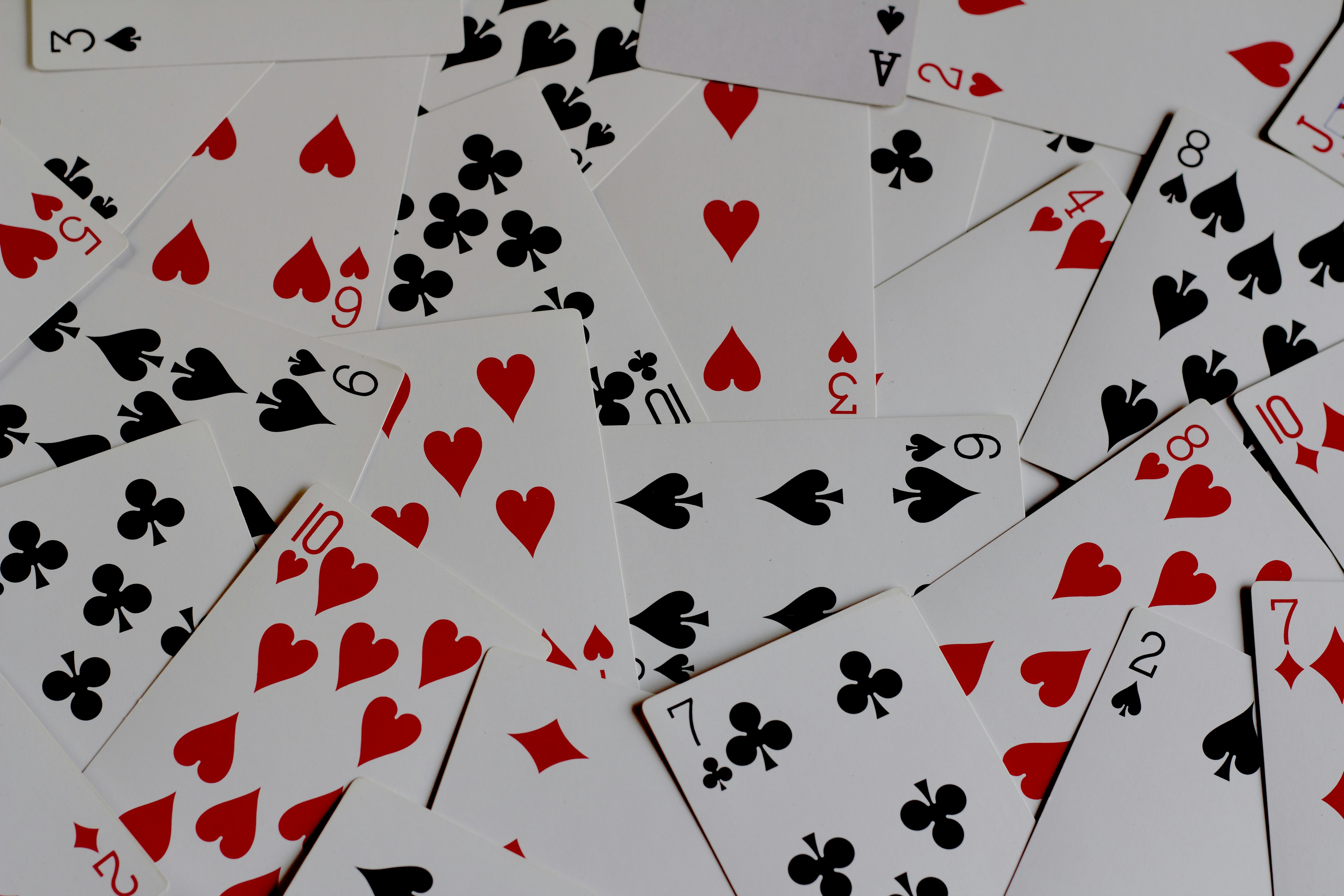 📜 The History of Simplicity: How the World's Easiest Magic Tricks Evolved by Magic Trick a pile of playing cards with hearts and spades
