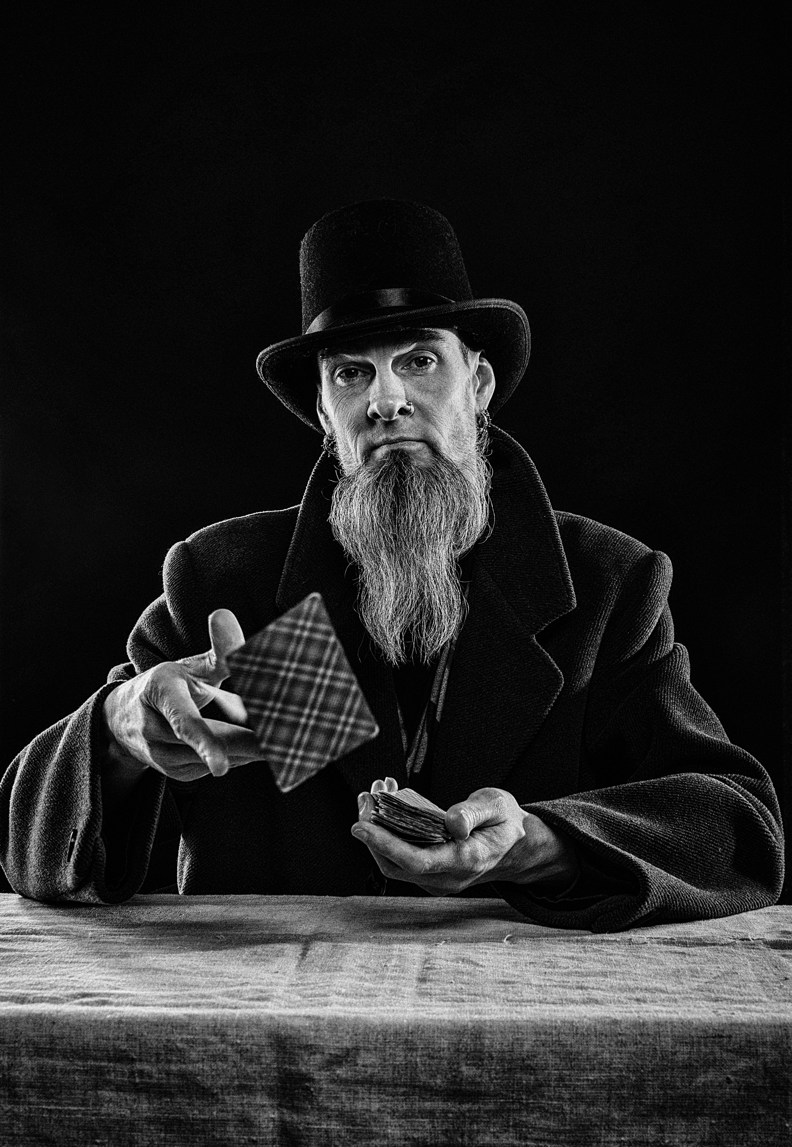 🎩 A Brief History of Magic Practice: From Court Jesters to Modern Masters by Magic Trick a man with a long beard and a hat holding a cigarette