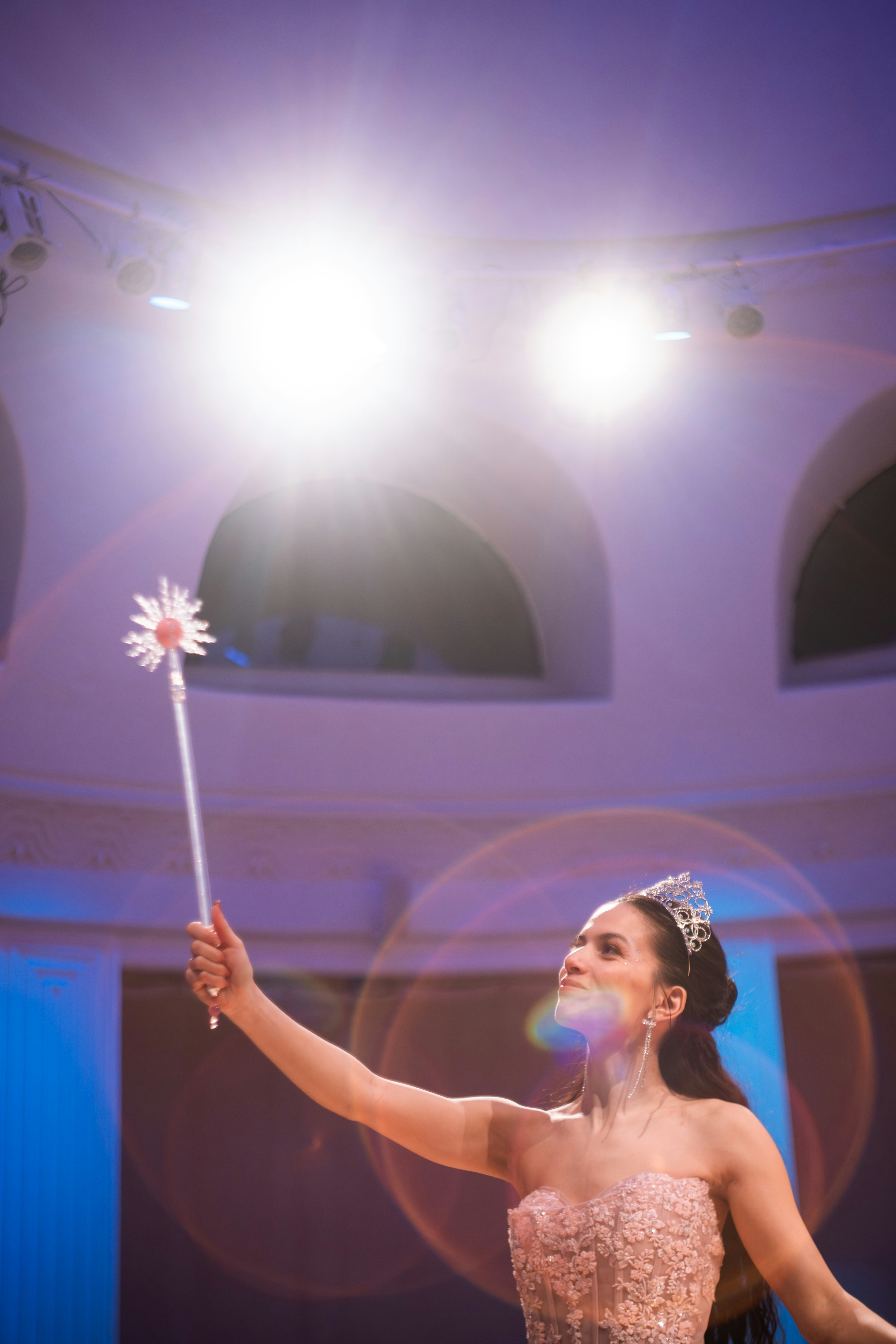 Photo by: Eryk Piotr Munk by Magic Trick A woman in a tiara and gown holds a wand