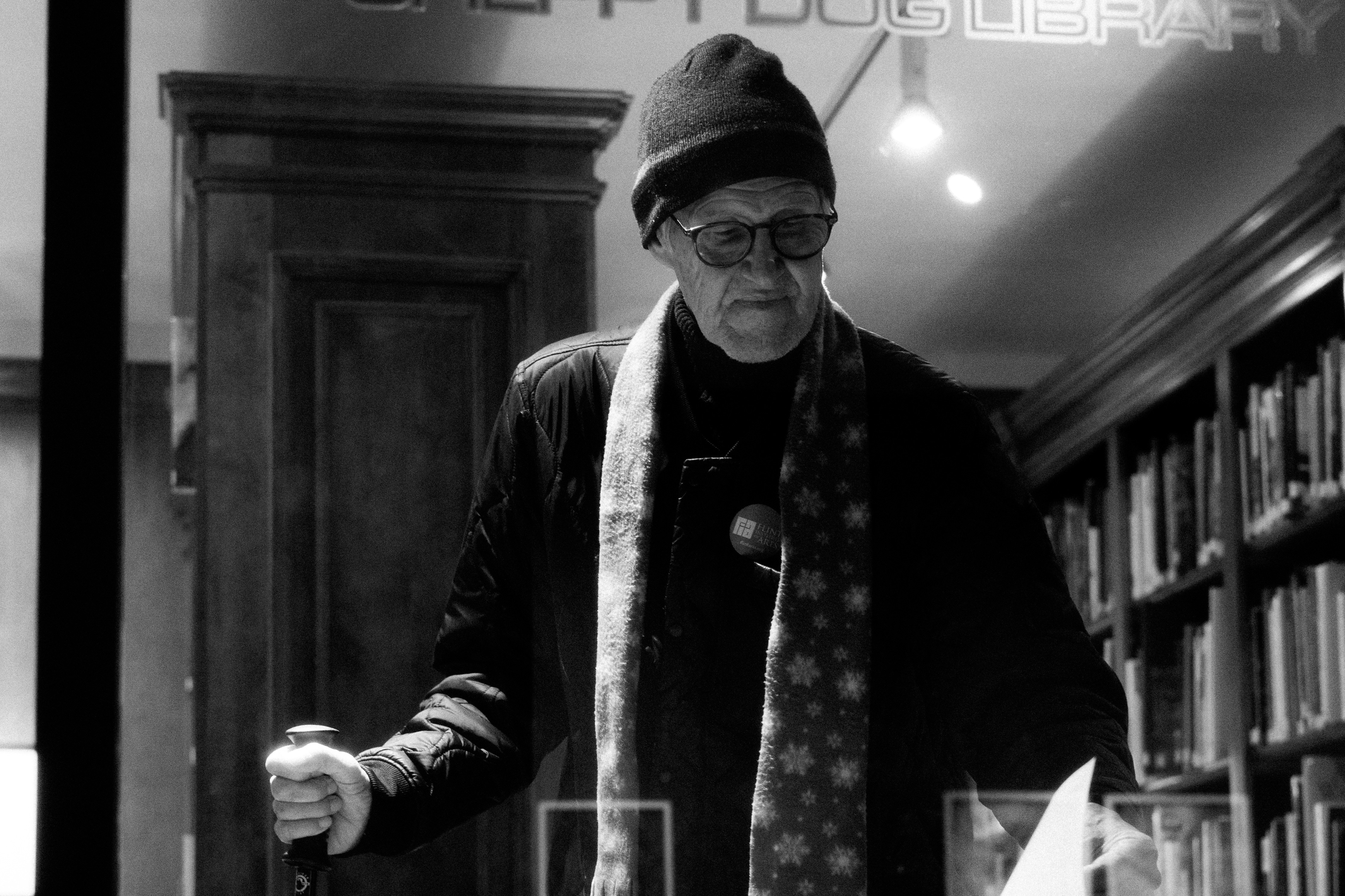 🏁 Conclusion by Magic Trick a man wearing a hat and scarf in a library