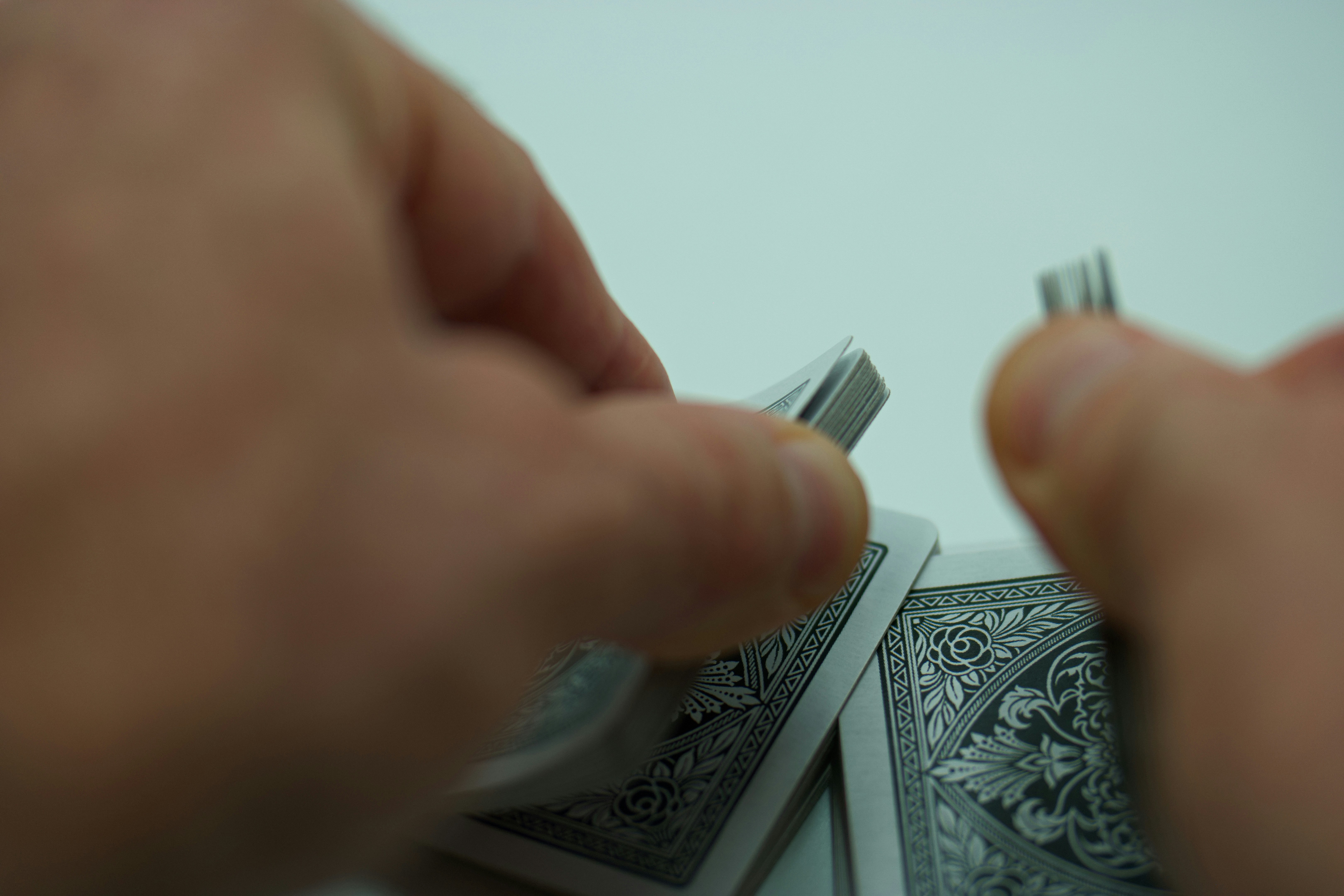 Where can I find tutorials for advanced magic tricks? by Magic Trick a person holding a toothbrush over a pile of playing cards