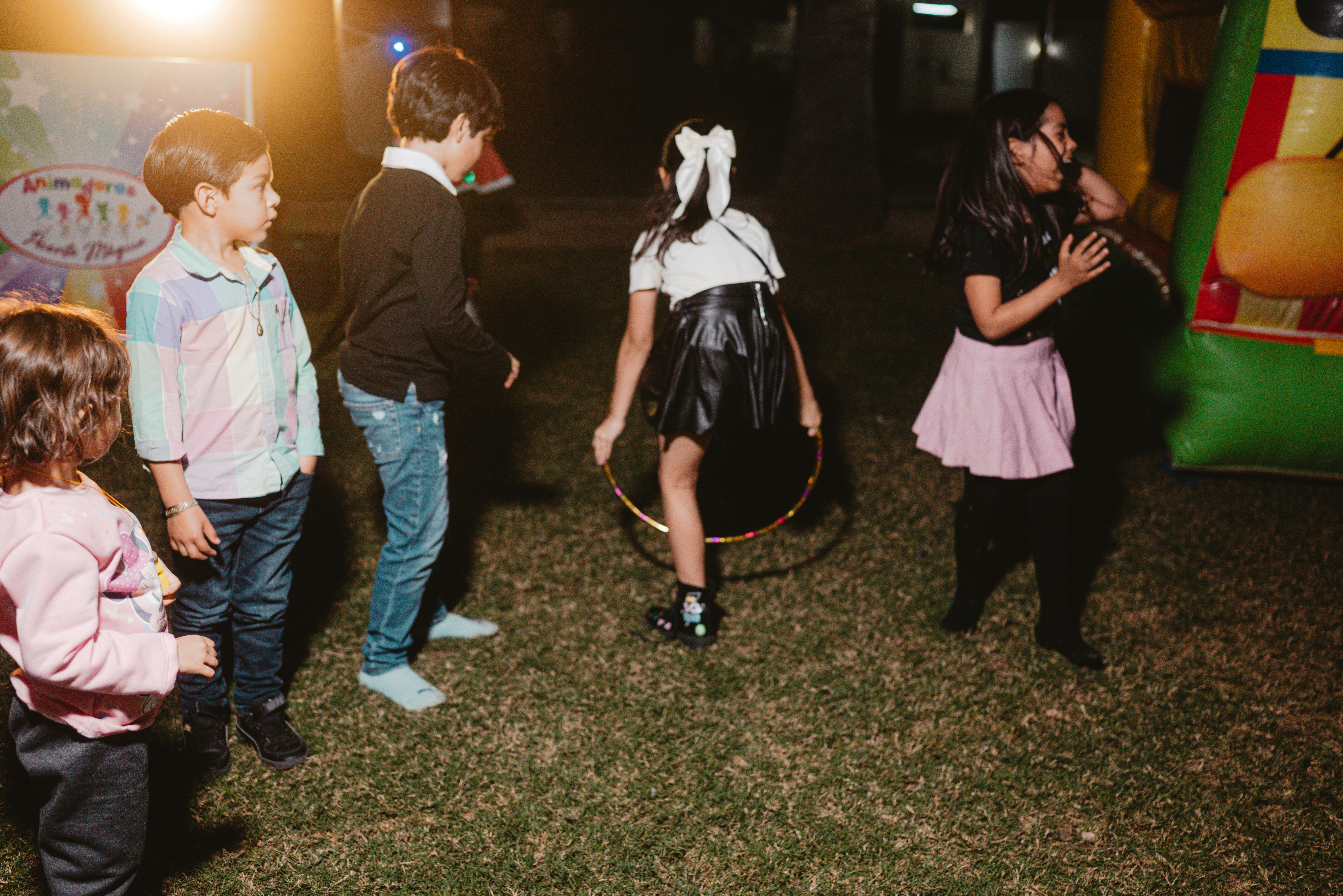 📜 A Brief History of Children's Party Magic Ideas by Magic Trick Children playing with a hula hoop at a party.