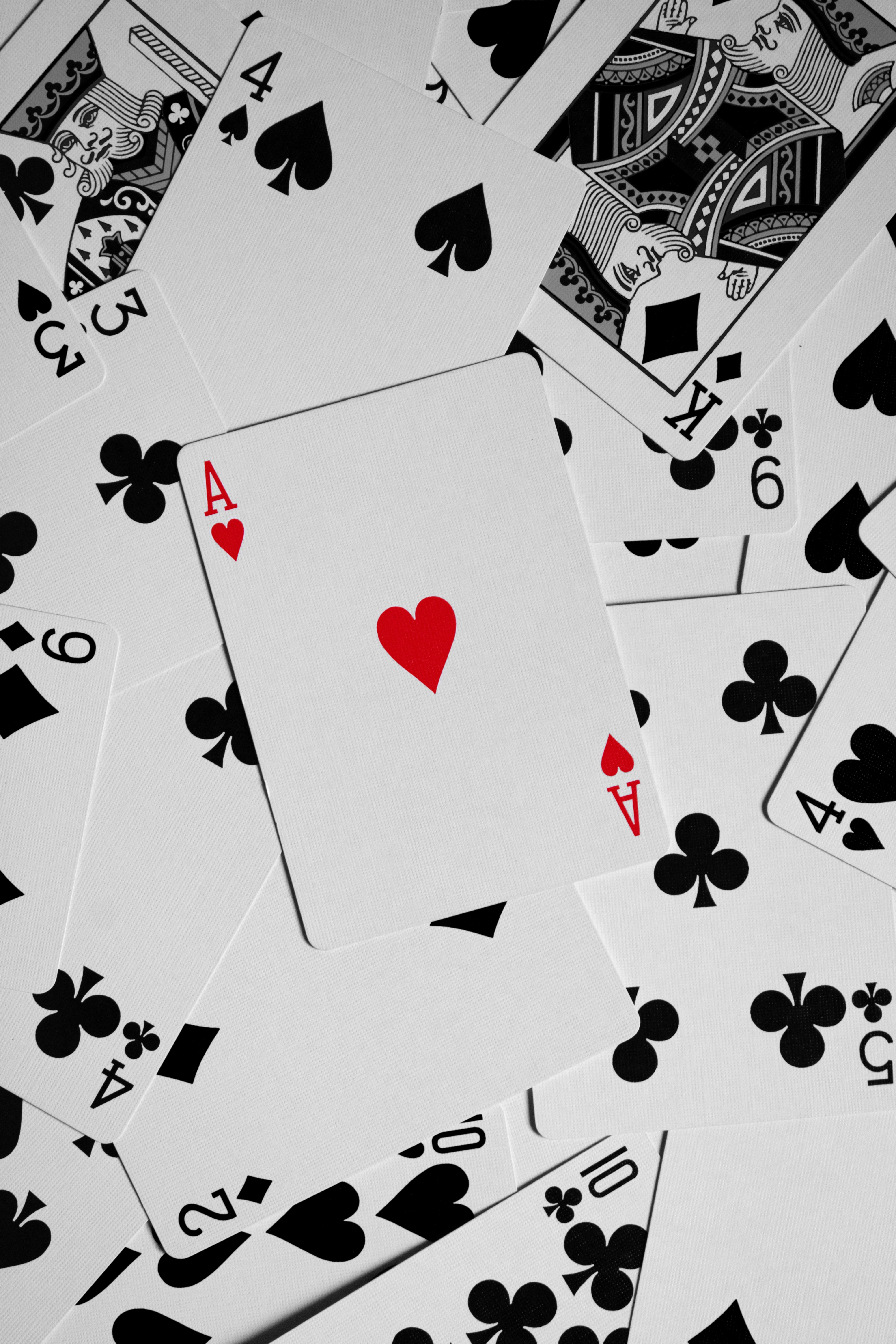 Ace of Hearts amidst all other cards. by Magic Trick heart shape red heart on white and black textile