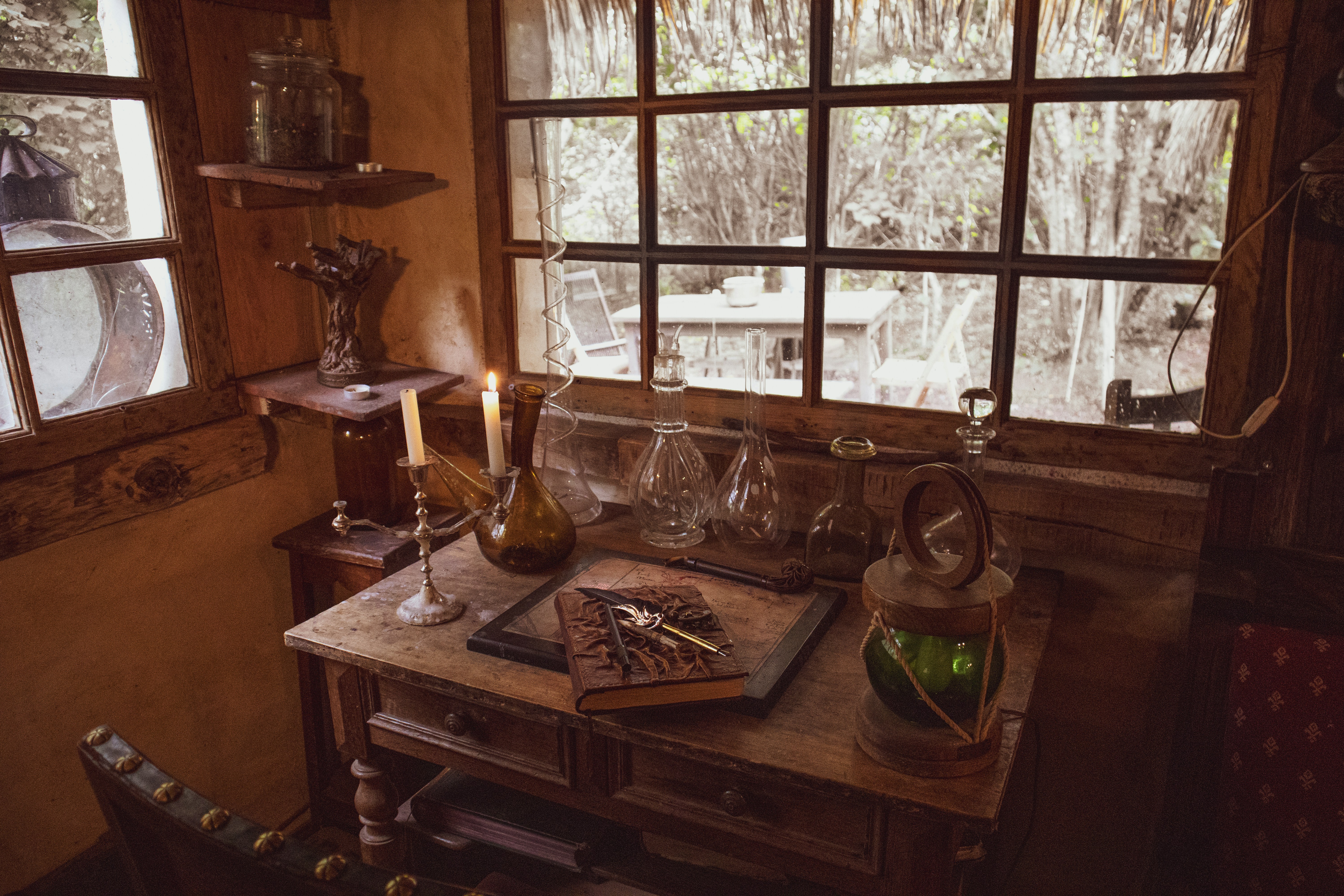 🎩 A Brief History of by Magic Trick a wooden table topped with a bottle of wine next to a window