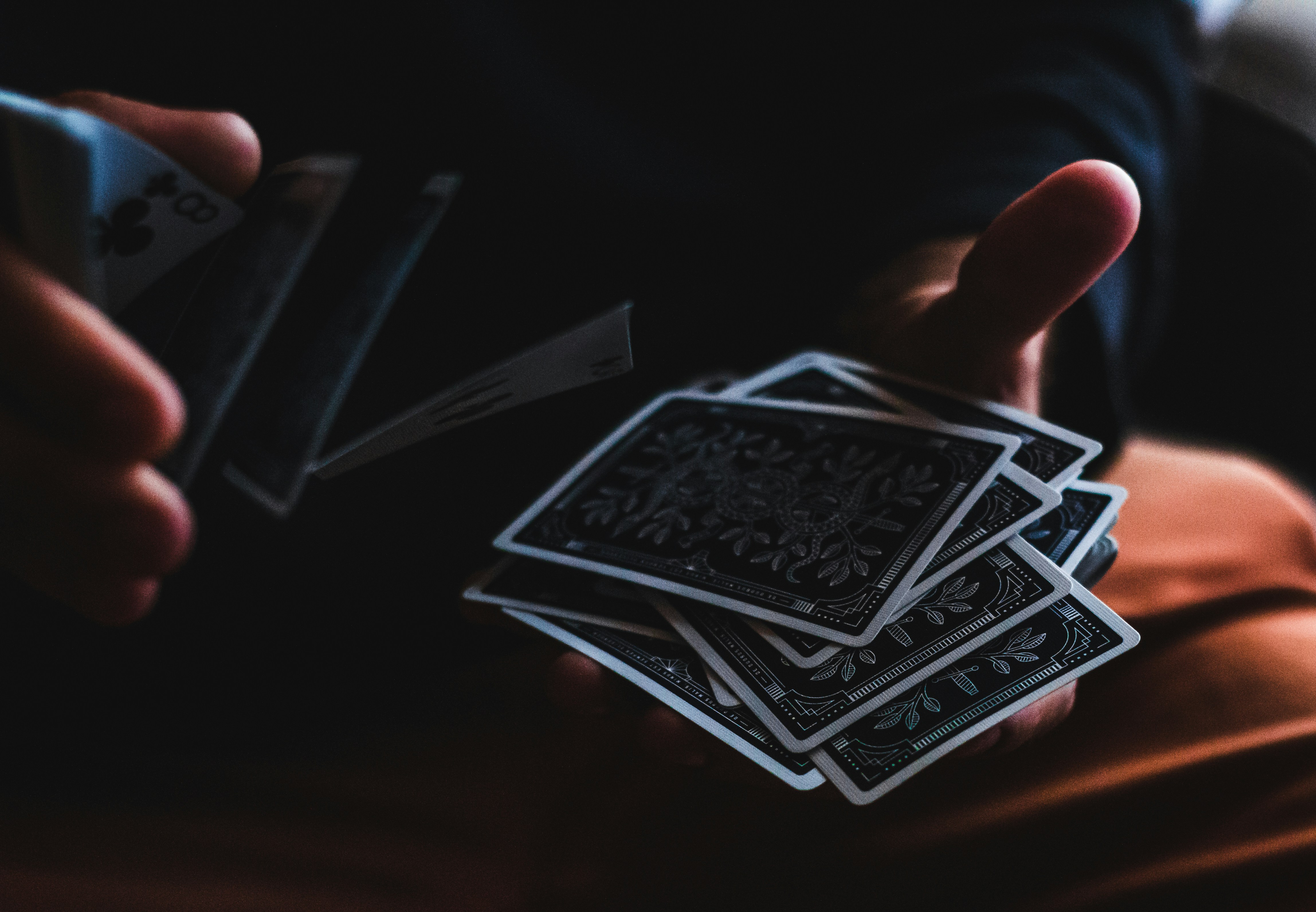 🃏 1. The Classic person playing with cards