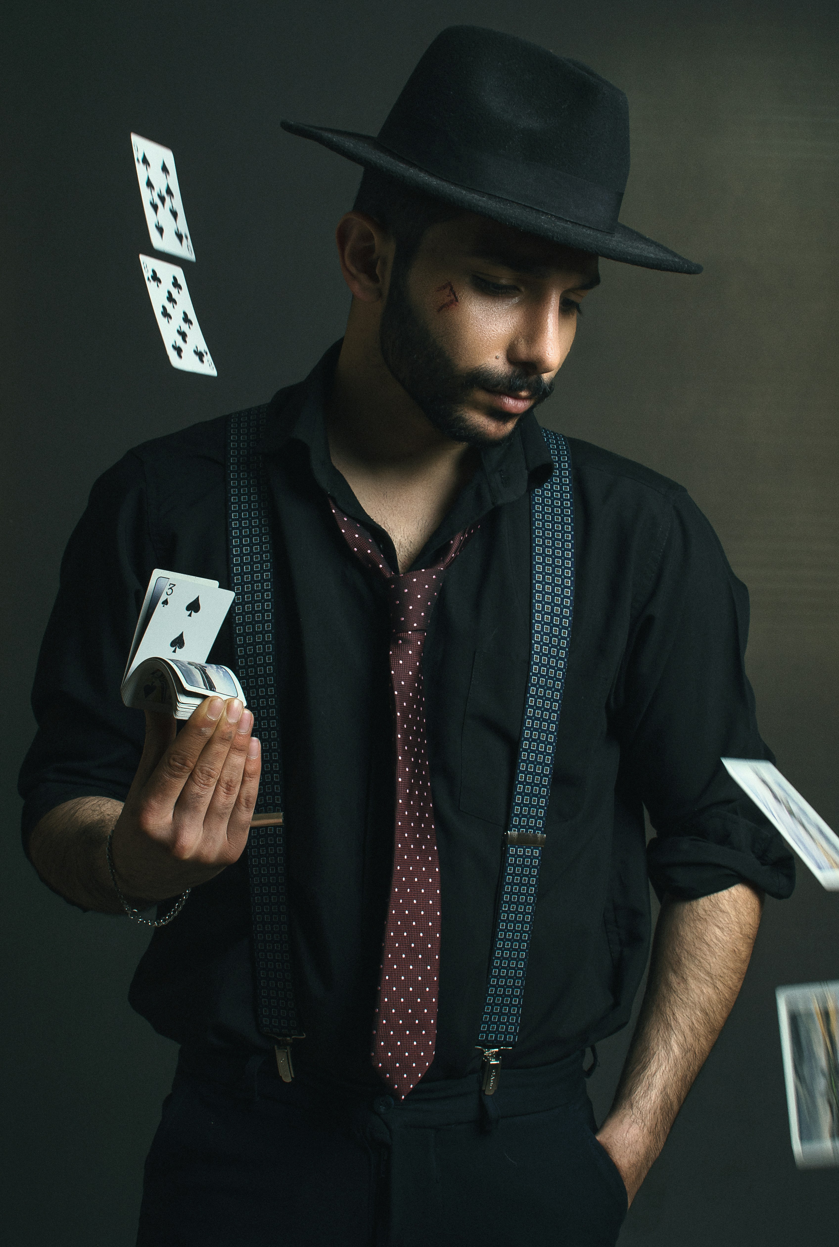 What is a easy magic trick? by Magic Trick man in black button up shirt holding white smartphone