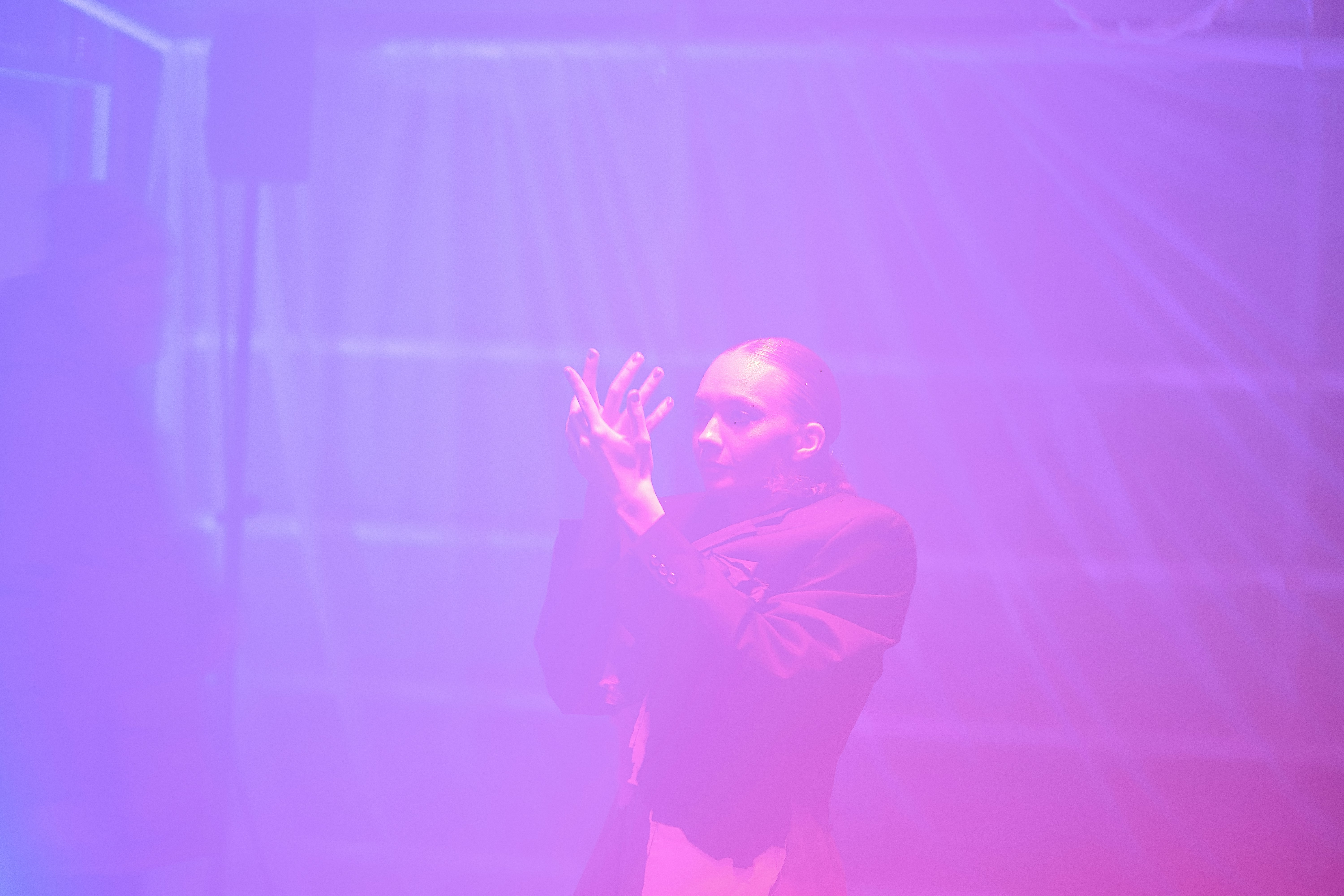 How can I improve my stage presence while performing magic tricks? by Magic Trick A person clapping hands in purple and pink light