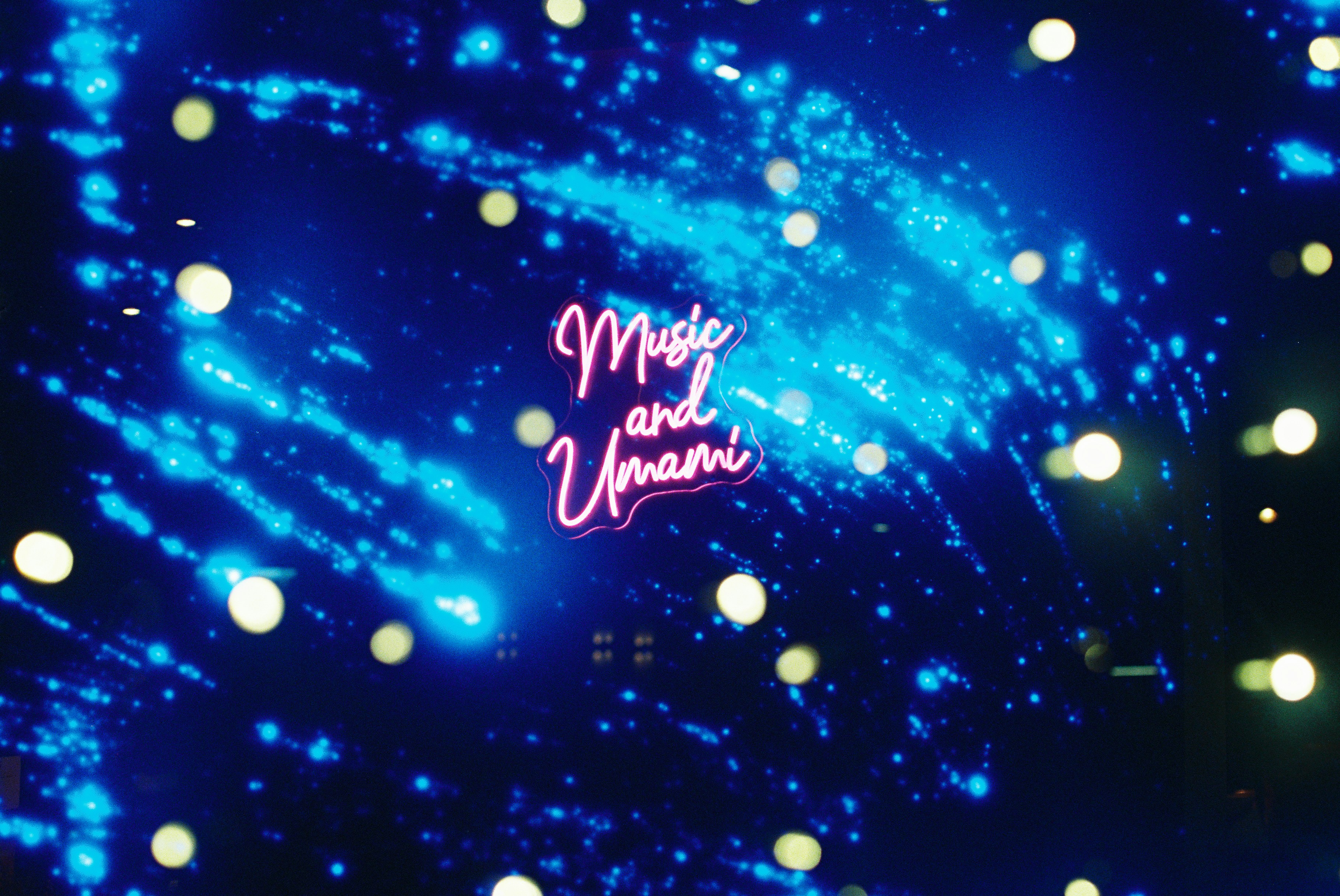🎩 The Evolution of Illusion: A Brief History of Virtual Magic Shows by Magic Trick Neon sign for 'muse and umani' against blue background