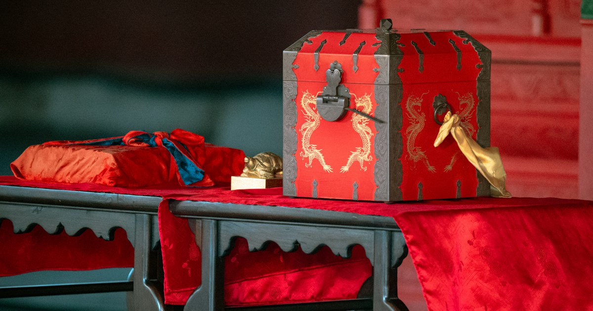 What is the oldest magic trick? by Magic Trick a table with a red table cloth on it