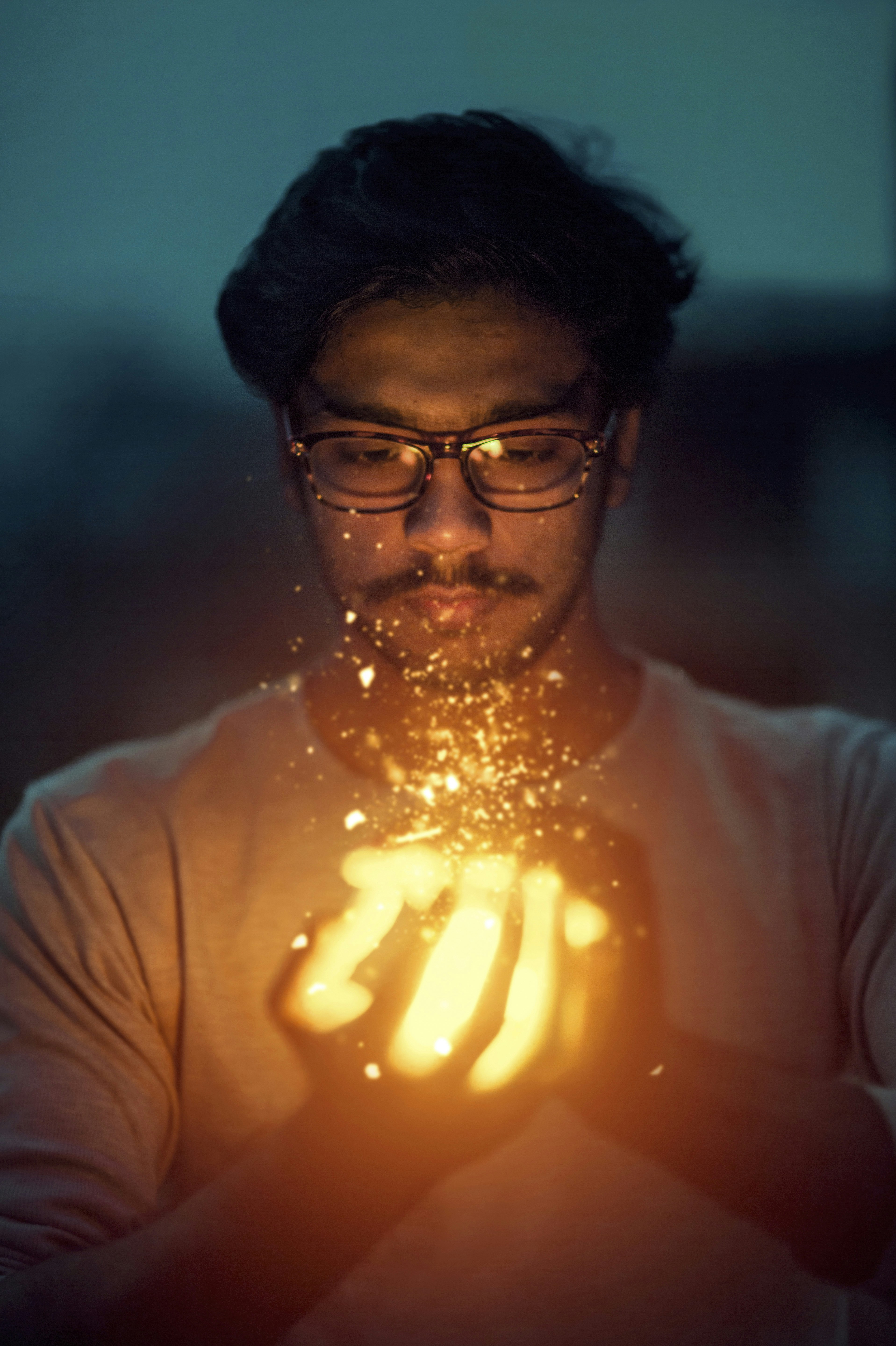❓ FAQ by Magic Trick man holding lighted art