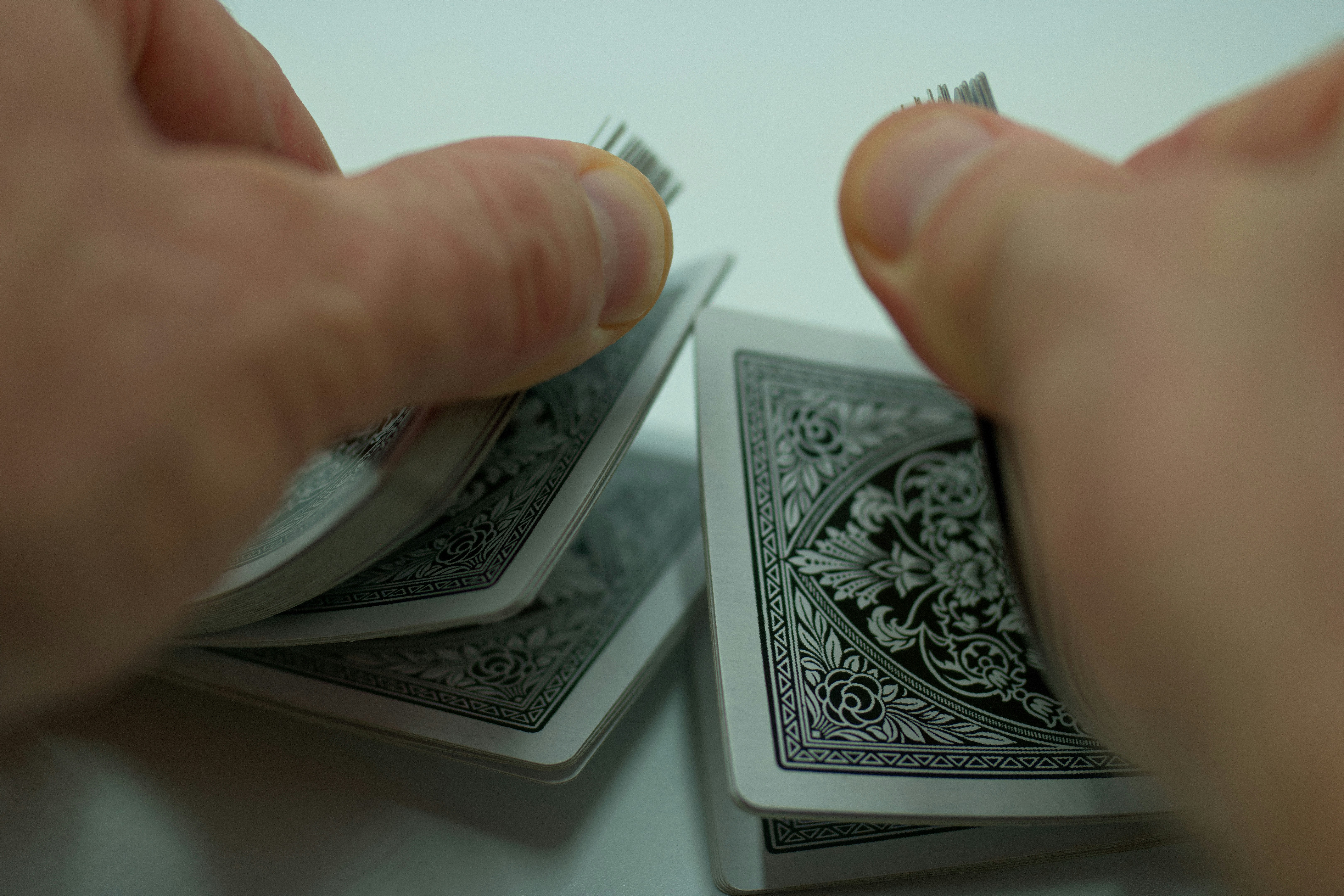 ❓ FAQ by Magic Trick a person holding a piece of playing cards
